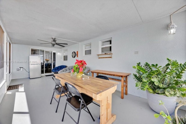 interior space with concrete flooring and ceiling fan