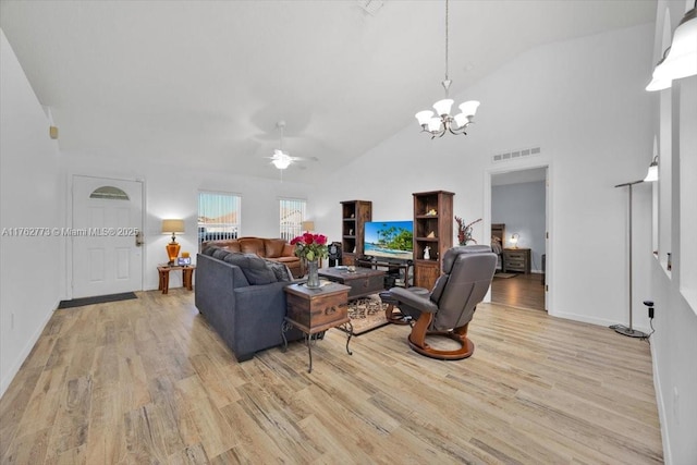 living area featuring visible vents, baseboards, light wood-type flooring, ceiling fan with notable chandelier, and high vaulted ceiling