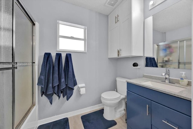 bathroom featuring vanity, baseboards, visible vents, shower / bath combination with glass door, and toilet