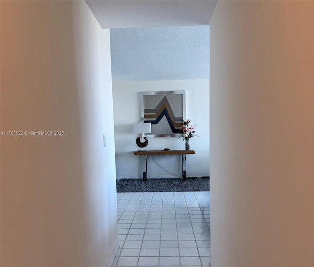 2451 Brickell Ave Unit 20N, Miami, FL 33129 - hall featuring light tile patterned floors and baseboards
