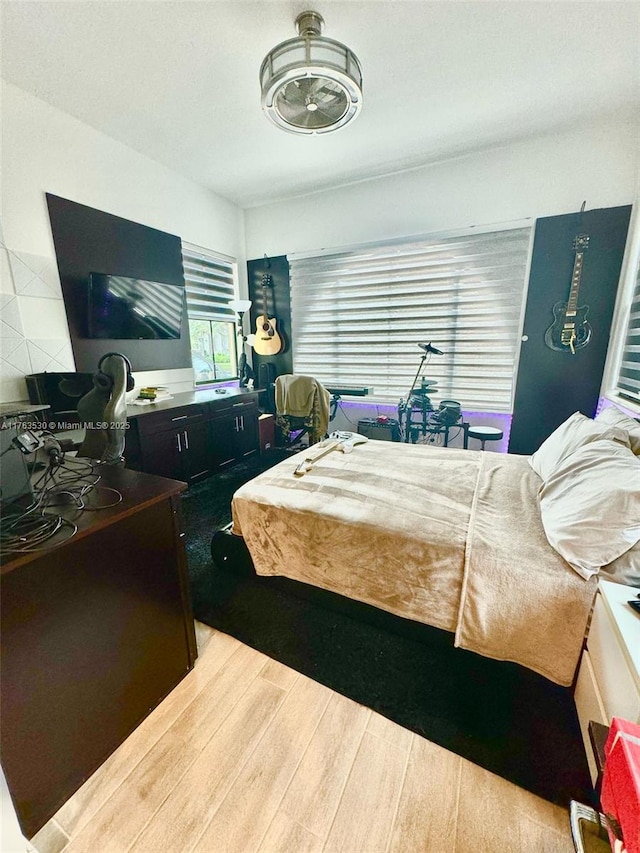 bedroom with wood finished floors