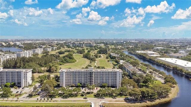 drone / aerial view featuring a view of city and a water view