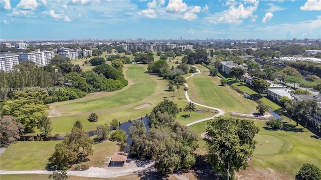 birds eye view of property featuring golf course view and a view of city