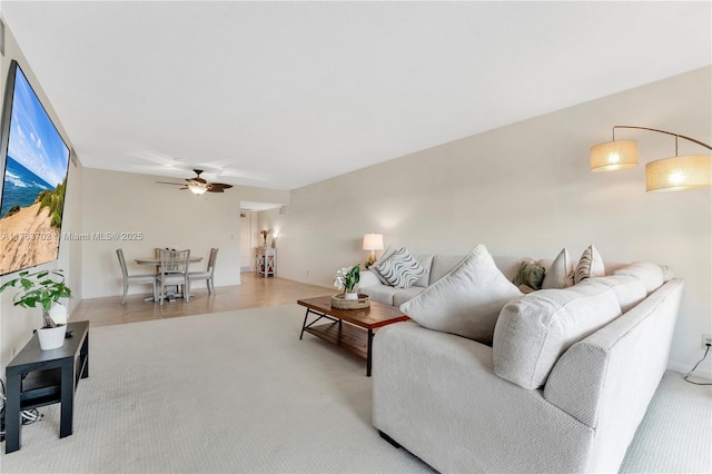 tiled living room with ceiling fan