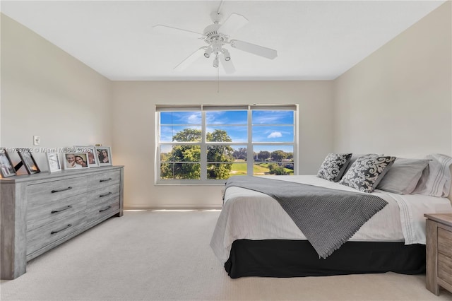 bedroom featuring ceiling fan and carpet floors