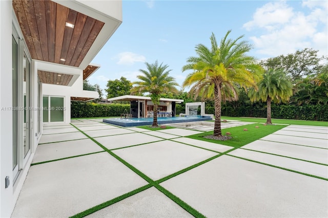 view of patio / terrace featuring a fenced in pool