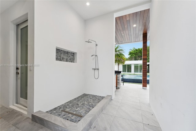 bathroom featuring tile patterned floors, walk in shower, and recessed lighting