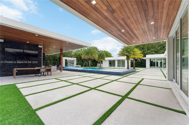 outdoor pool with an outdoor structure and a patio area