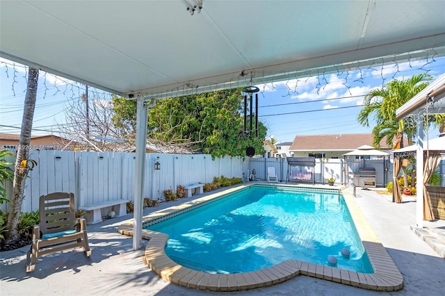 view of swimming pool featuring a gazebo, a fenced backyard, and a patio