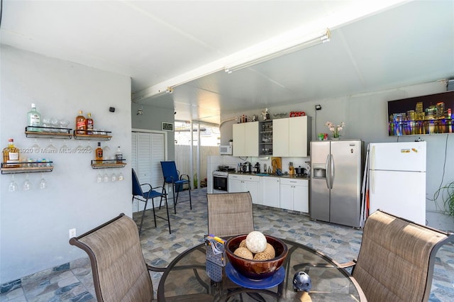 dining area featuring light floors