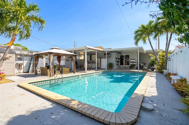 view of pool featuring a gazebo, a fenced in pool, fence, and a patio area