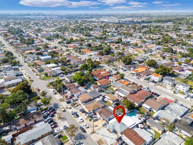 birds eye view of property with a residential view