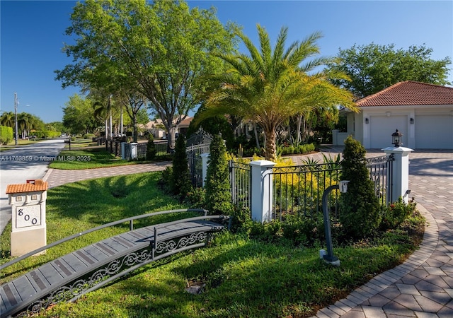 exterior space with driveway and fence