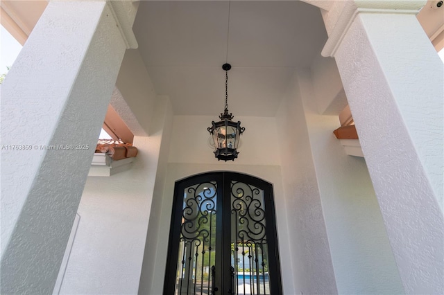 entrance to property with stucco siding