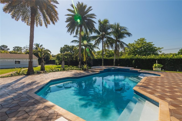 view of pool featuring a patio, a fenced in pool, and fence