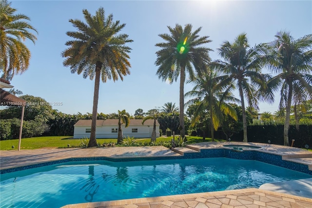 pool featuring an in ground hot tub