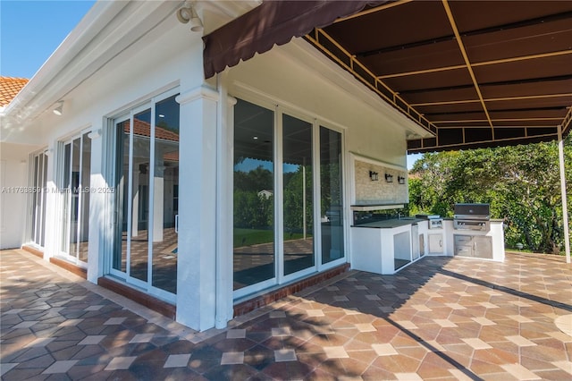 view of patio featuring grilling area and an outdoor kitchen