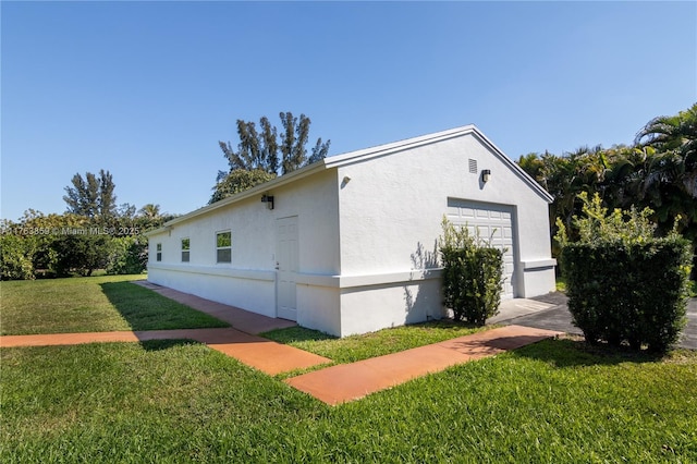 view of home's exterior with a yard and stucco siding