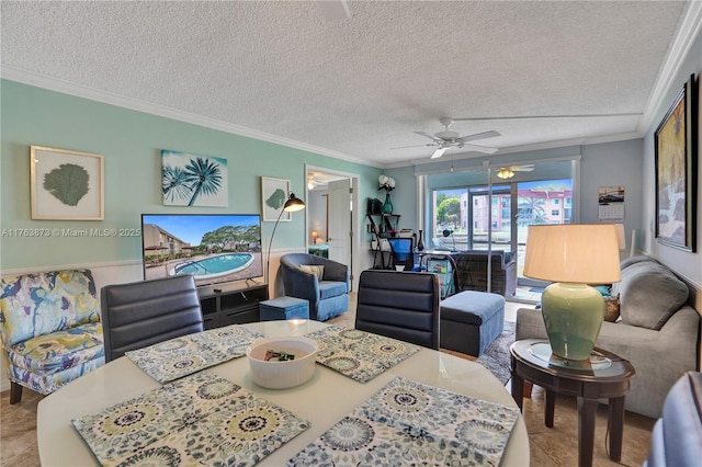 dining area featuring a textured ceiling, ceiling fan, crown molding, and tile patterned flooring