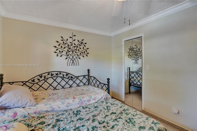 bedroom featuring crown molding, baseboards, a closet, and a textured ceiling