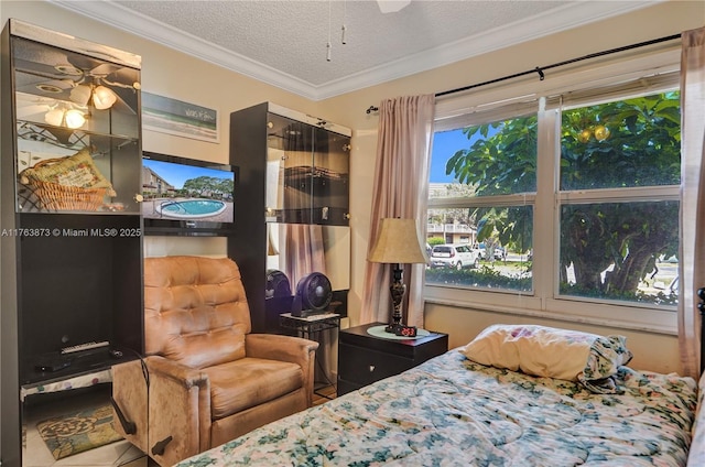 bedroom with multiple windows, a textured ceiling, and crown molding