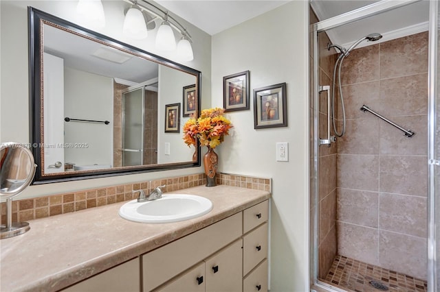 full bathroom with vanity, tasteful backsplash, and a stall shower