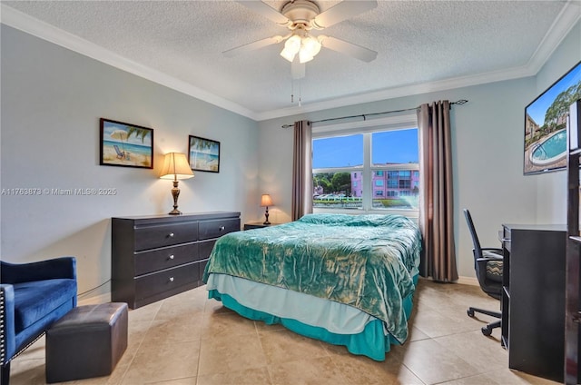 bedroom featuring baseboards, light tile patterned flooring, ceiling fan, ornamental molding, and a textured ceiling