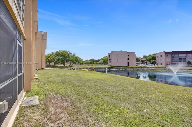 view of yard with a water view