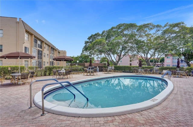 view of pool with fence