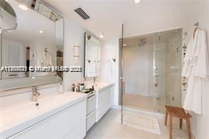 bathroom with recessed lighting, visible vents, a stall shower, and vanity