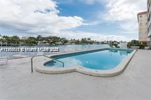 pool with a patio area