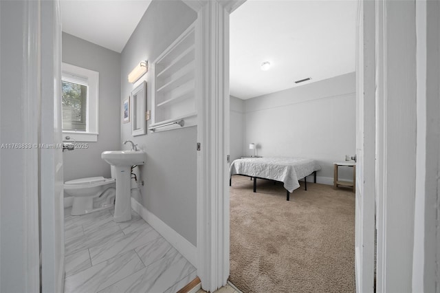 bathroom with visible vents, baseboards, toilet, and marble finish floor