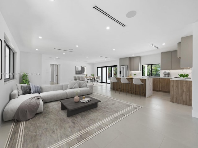 living room with visible vents and recessed lighting