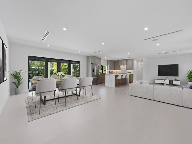 dining area with recessed lighting and baseboards