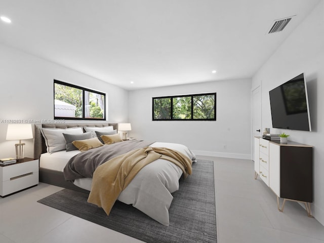 bedroom with multiple windows, recessed lighting, and visible vents