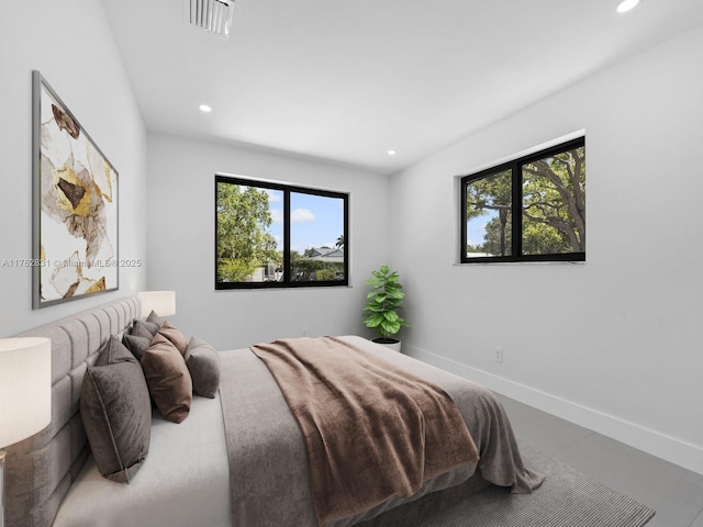 bedroom featuring recessed lighting, baseboards, multiple windows, and visible vents