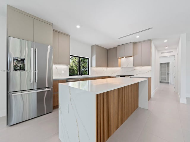 kitchen with backsplash, gray cabinetry, stainless steel appliances, and modern cabinets