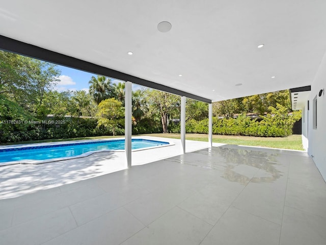 view of swimming pool featuring a fenced in pool and a patio area