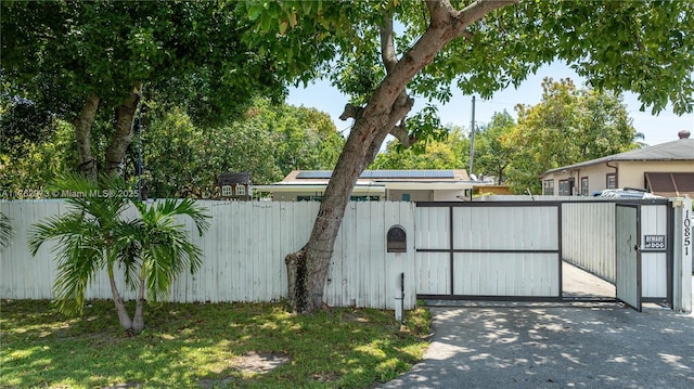 view of gate with fence