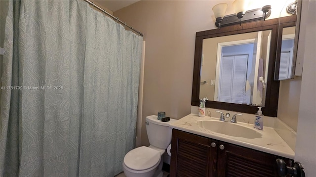 full bath with vanity and toilet