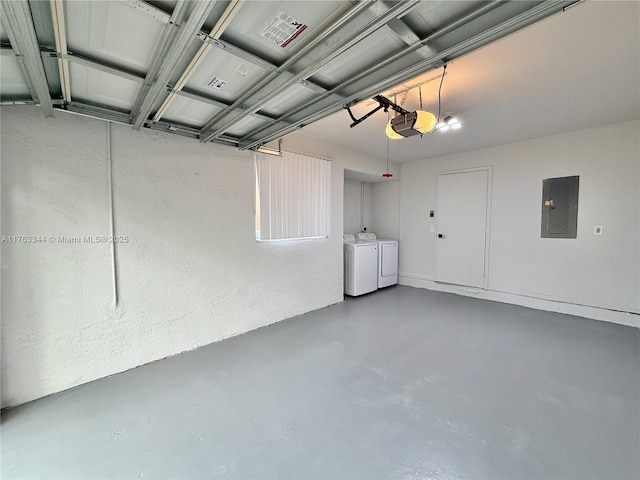 garage with electric panel, washer and dryer, and a garage door opener