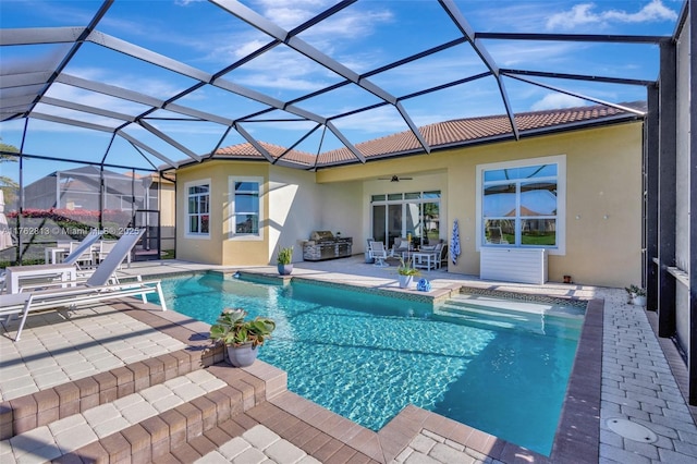 pool featuring a patio, a lanai, and ceiling fan