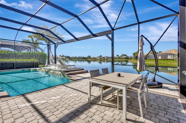 view of patio / terrace featuring a lanai, an outdoor pool, and a water view