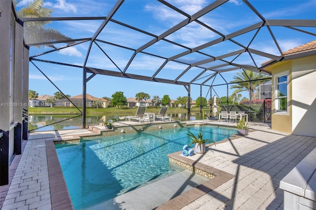 outdoor pool featuring a patio, a lanai, and a water view