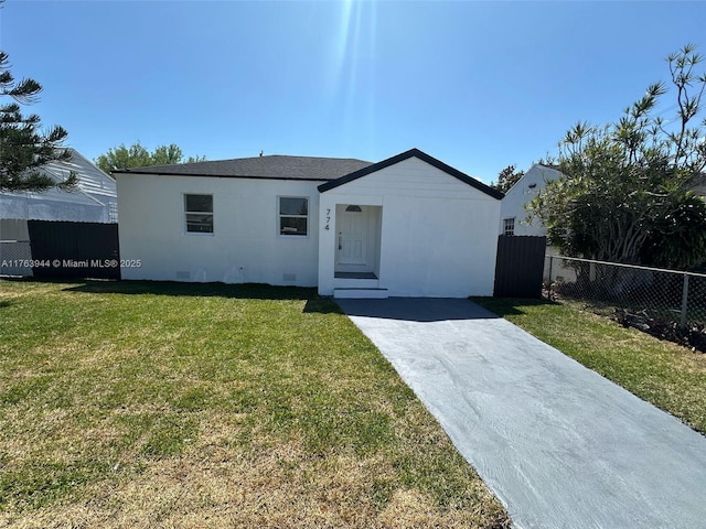 view of front facade with crawl space, a front yard, and fence