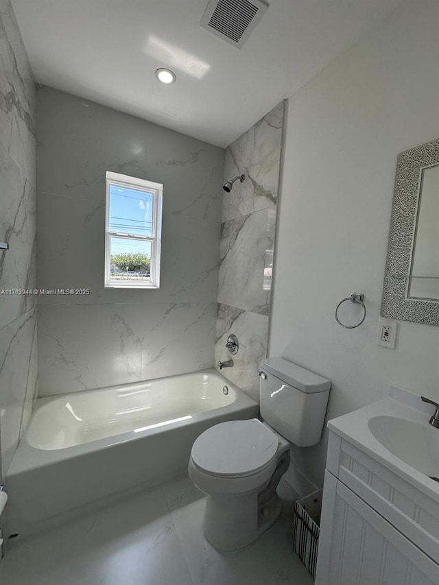 bathroom featuring visible vents, washtub / shower combination, toilet, marble finish floor, and vanity