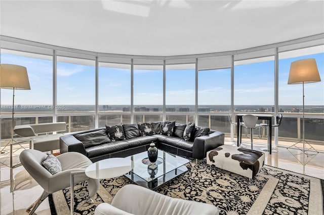 tiled living area with floor to ceiling windows and a water view