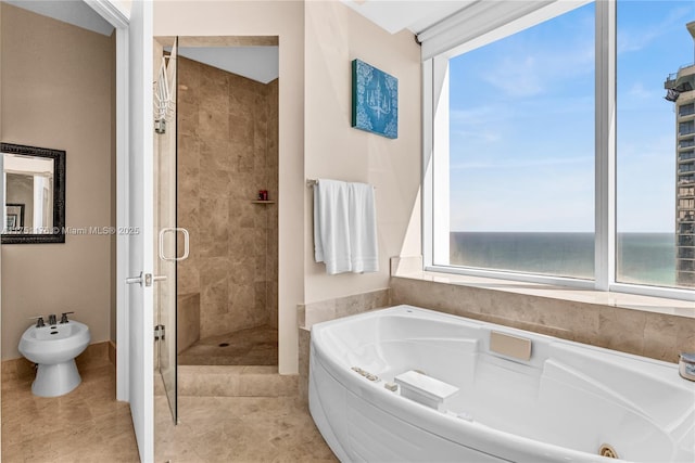 full bathroom featuring a jetted tub, a water view, and a stall shower