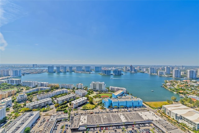 bird's eye view featuring a view of city and a water view