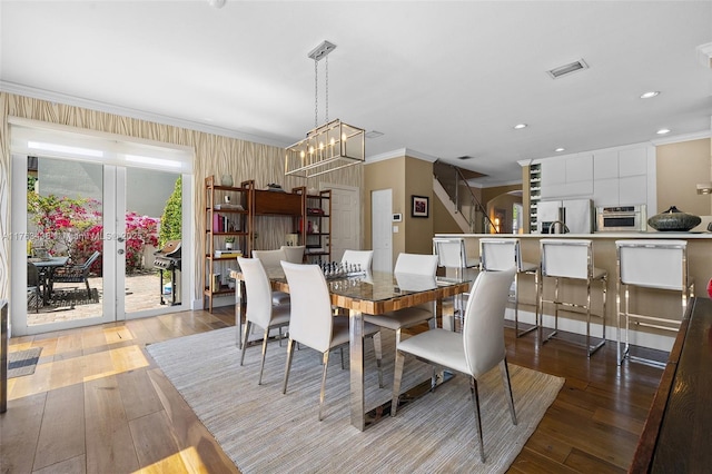 dining room featuring crown molding, recessed lighting, visible vents, and wood-type flooring